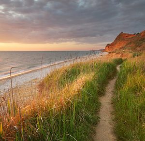 Beautiful seascape featuring hill, outdoor, and way