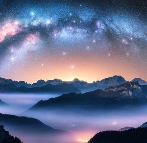 Milky Way arch above mountains in