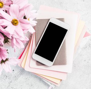 Pink and Grey Feminine Office Desktop Flat Lay with a smartphone and copy space
